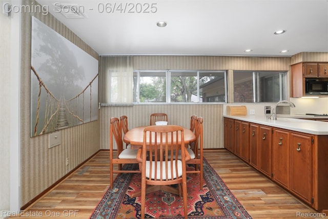 439 Barclay Rd, Grosse Pointe Farms, MI 48236 - dining room featuring wallpapered walls, light wood-style floors, and recessed lighting