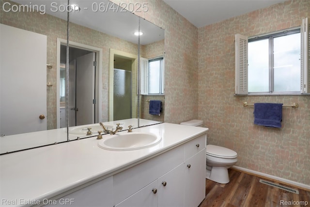 439 Barclay Rd, Grosse Pointe Farms, MI 48236 - full bathroom featuring toilet, wood finished floors, vanity, a stall shower, and tile walls