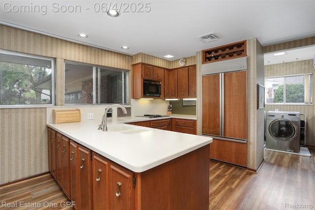 439 Barclay Rd, Grosse Pointe Farms, MI 48236 - kitchen with black appliances, a sink, washer / clothes dryer, a peninsula, and wallpapered walls