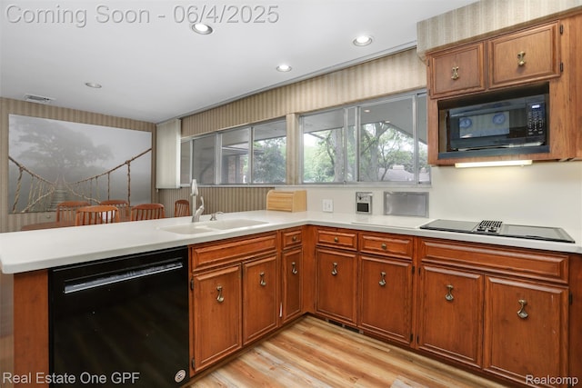 439 Barclay Rd, Grosse Pointe Farms, MI 48236 - kitchen featuring black appliances, brown cabinetry, light countertops, and recessed lighting