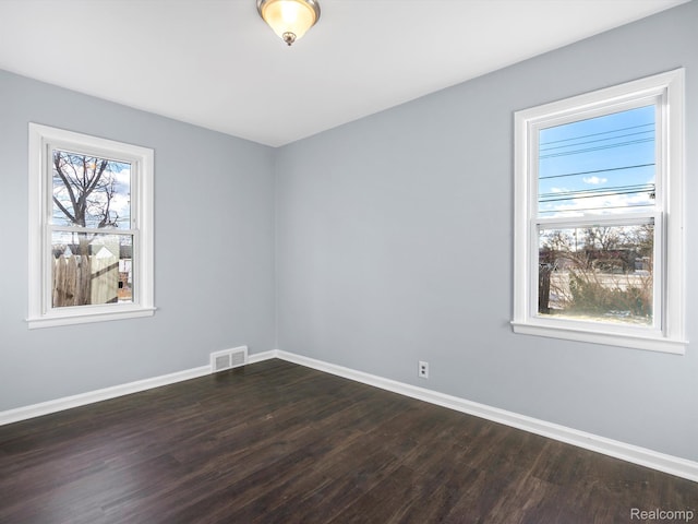 3752 Katherine St, Dearborn, MI 48124 - empty room featuring dark wood finished floors and baseboards