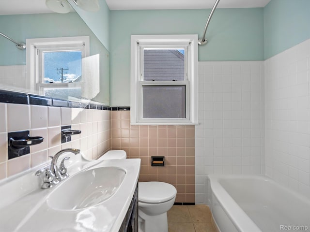3752 Katherine St, Dearborn, MI 48124 - bathroom featuring tile walls, toilet, tile patterned floors, vanity, and a wainscoted wall
