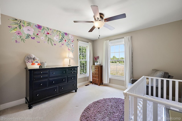 1707 Mountain Ash Dr, West Bloomfield, MI 48324 - bedroom featuring light colored carpet, baseboards, a nursery area, and a ceiling fan