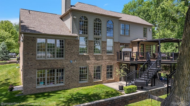 1707 Mountain Ash Dr, West Bloomfield, MI 48324 - rear view of property with a wooden deck, brick siding, a yard, a patio, and a chimney