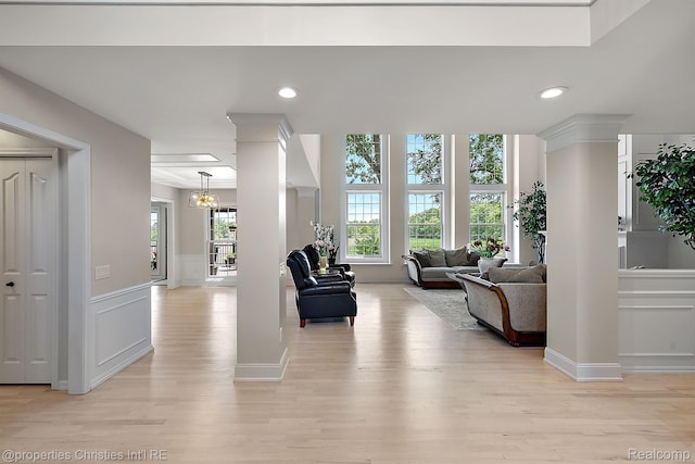 1707 Mountain Ash Dr, West Bloomfield, MI 48324 - living room with decorative columns, a decorative wall, light wood finished floors, a wainscoted wall, and recessed lighting