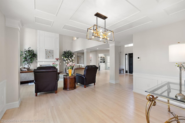 1707 Mountain Ash Dr, West Bloomfield, MI 48324 - living room with light wood-type flooring, decorative columns, wainscoting, and a decorative wall