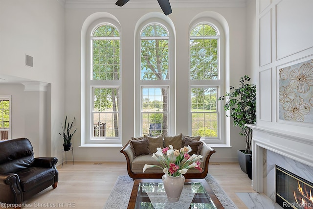 1707 Mountain Ash Dr, West Bloomfield, MI 48324 - living room featuring a high ceiling, healthy amount of natural light, a ceiling fan, and light wood-type flooring