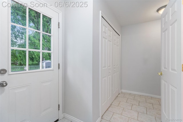 39650 Macomber St, Harrison Township, MI 48045 - entryway featuring baseboards, healthy amount of natural light, and light tile patterned flooring