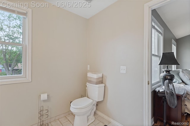39650 Macomber St, Harrison Township, MI 48045 - bathroom featuring toilet, baseboards, and tile patterned flooring