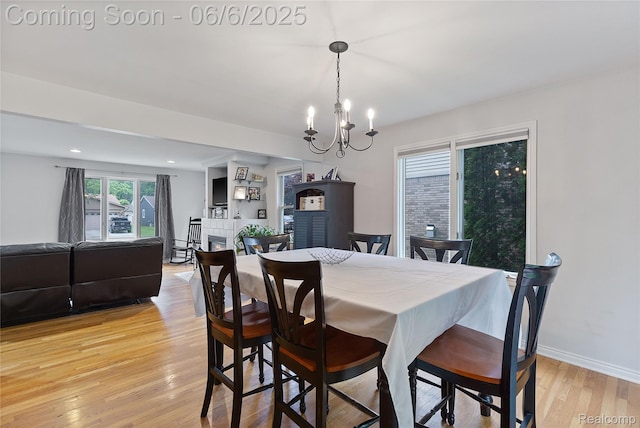 39650 Macomber St, Harrison Township, MI 48045 - dining room featuring light wood-style floors, a chandelier, and baseboards