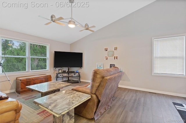 39650 Macomber St, Harrison Township, MI 48045 - living room featuring ceiling fan, wood finished floors, baseboards, and high vaulted ceiling