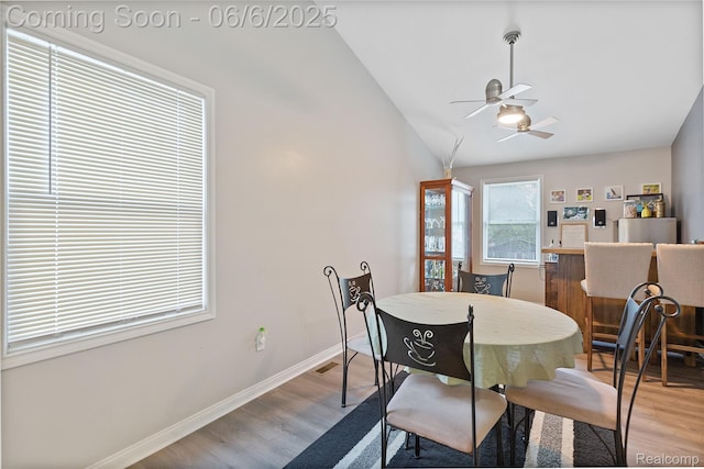 39650 Macomber St, Harrison Township, MI 48045 - dining room featuring vaulted ceiling, a ceiling fan, light wood-style flooring, and baseboards