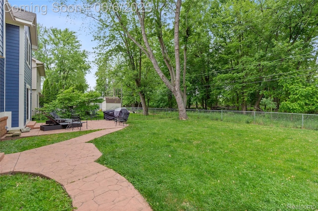 39650 Macomber St, Harrison Township, MI 48045 - view of yard featuring a patio and view of wooded area