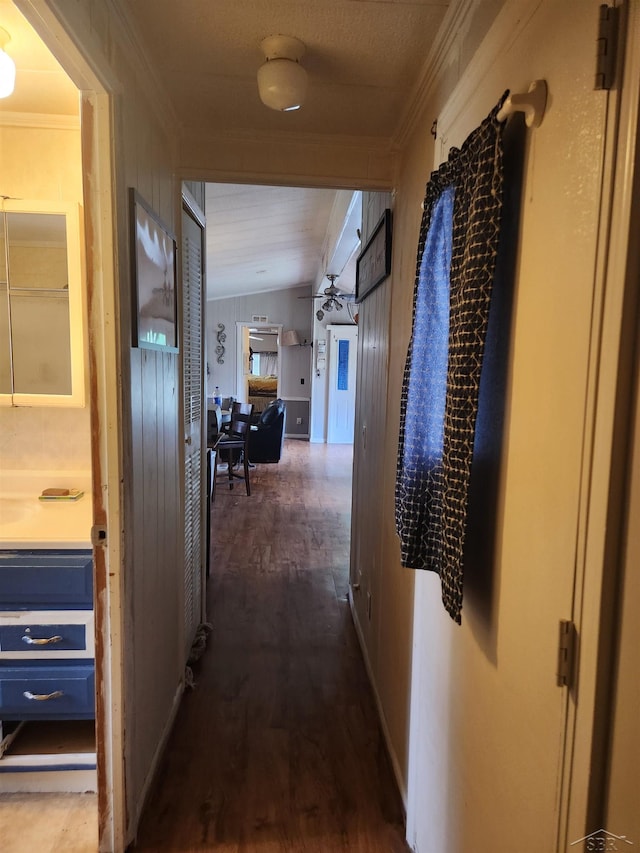 1610 Sunburst St, Grawn, MI 49637 - corridor with ornamental molding, vaulted ceiling, and wood finished floors