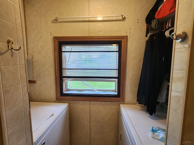 1610 Sunburst St, Grawn, MI 49637 - laundry room featuring washer / clothes dryer and tile walls