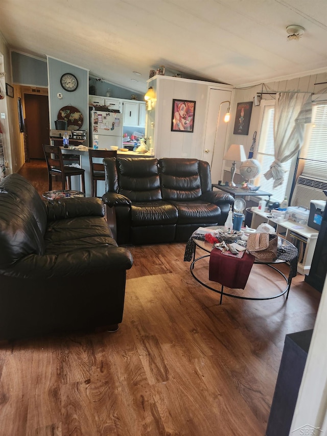 1610 Sunburst St, Grawn, MI 49637 - living area featuring wood finished floors and lofted ceiling