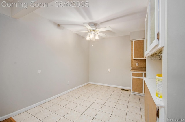 29280 Gloede Dr Unit D7, Warren, MI 48088 - unfurnished room with ceiling fan, light tile patterned flooring, and baseboards