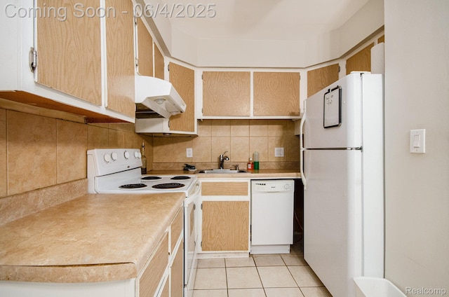 29280 Gloede Dr Unit D7, Warren, MI 48088 - kitchen featuring white appliances, under cabinet range hood, a sink, decorative backsplash, and light countertops
