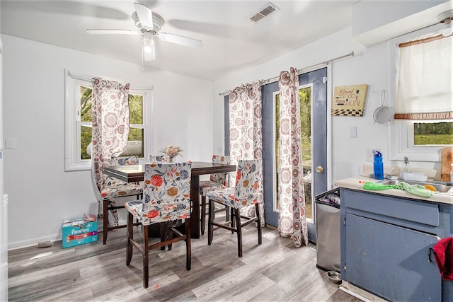 236 Mary St, Plainwell, MI 49080 - dining room with light wood-type flooring and ceiling fan