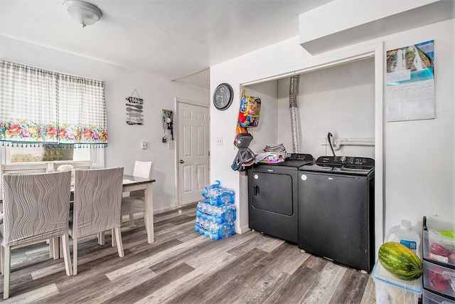 236 Mary St, Plainwell, MI 49080 - laundry area with separate washer and dryer and wood finished floors