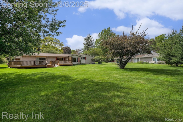 11641 Juniper Dr, Van Buren, MI 48111 - view of green lawn featuring a deck