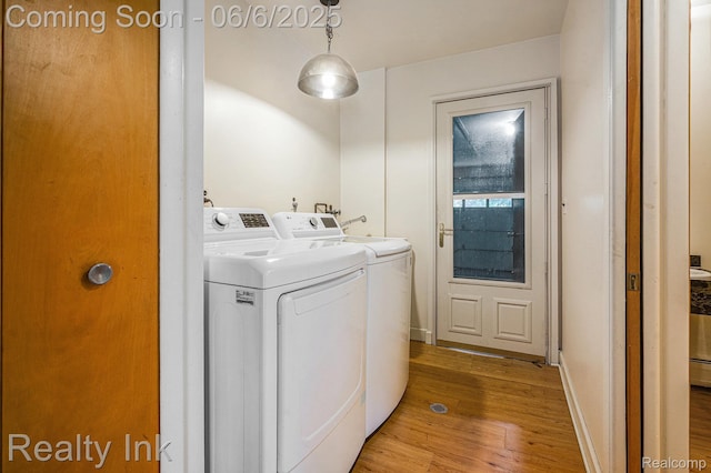 11641 Juniper Dr, Van Buren, MI 48111 - laundry area with washing machine and dryer and light wood-type flooring