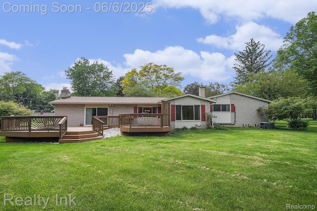11641 Juniper Dr, Van Buren, MI 48111 - back of property with a chimney, brick siding, a wooden deck, and a yard
