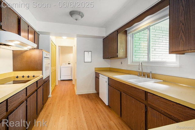 11641 Juniper Dr, Van Buren, MI 48111 - kitchen with washer / dryer, a sink, white appliances, light wood-style flooring, and light countertops