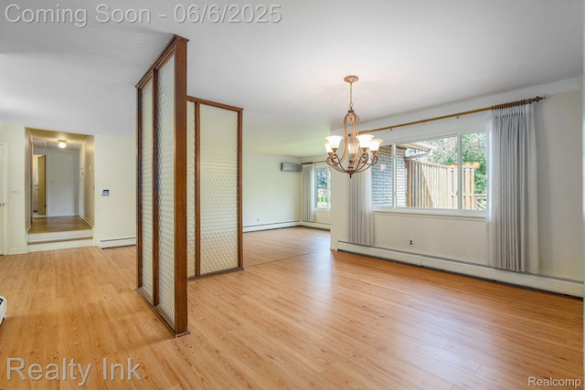 11641 Juniper Dr, Van Buren, MI 48111 - spare room featuring a baseboard heating unit, light wood-type flooring, and a chandelier