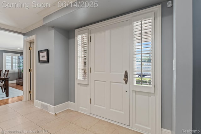 457 N Cranbrook Rd, Bloomfield Hills, MI 48301 - entryway featuring ornamental molding and light tile patterned flooring