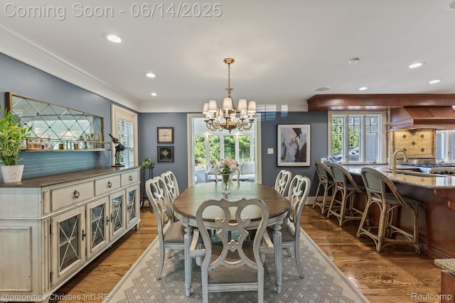 457 N Cranbrook Rd, Bloomfield Hills, MI 48301 - dining area with a chandelier, wood finished floors, ornamental molding, recessed lighting, and plenty of natural light