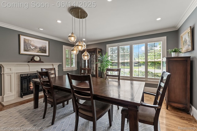457 N Cranbrook Rd, Bloomfield Hills, MI 48301 - dining room with healthy amount of natural light, ornamental molding, recessed lighting, a high end fireplace, and light wood-style floors