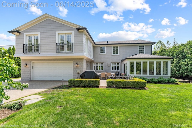 457 N Cranbrook Rd, Bloomfield Hills, MI 48301 - back of house with a garage, a lawn, driveway, and brick siding