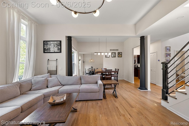 871 Wynstone Cir S, Oakland, MI 48363 - living area with light wood-style floors, stairs, and baseboards