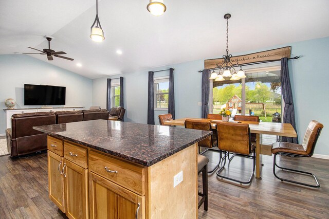 69698 Fox Xing, Edwardsburg, MI 49112 - kitchen with ceiling fan, dark wood-style flooring, a center island, vaulted ceiling, and hanging light fixtures