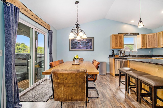 69698 Fox Xing, Edwardsburg, MI 49112 - dining area featuring lofted ceiling, a chandelier, light wood finished floors, and recessed lighting