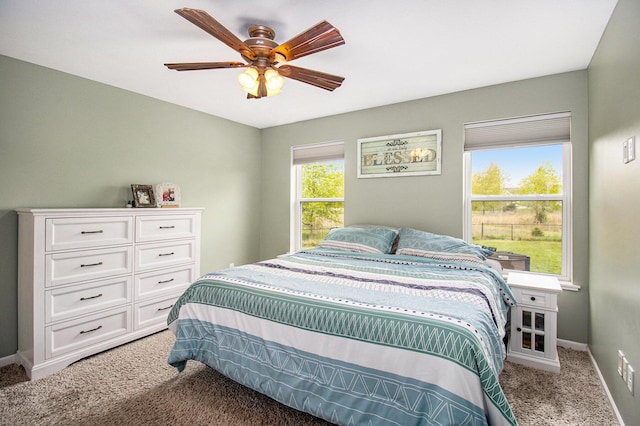 69698 Fox Xing, Edwardsburg, MI 49112 - bedroom featuring light carpet, baseboards, and ceiling fan