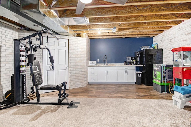 69698 Fox Xing, Edwardsburg, MI 49112 - exercise area with wood finished floors and a sink