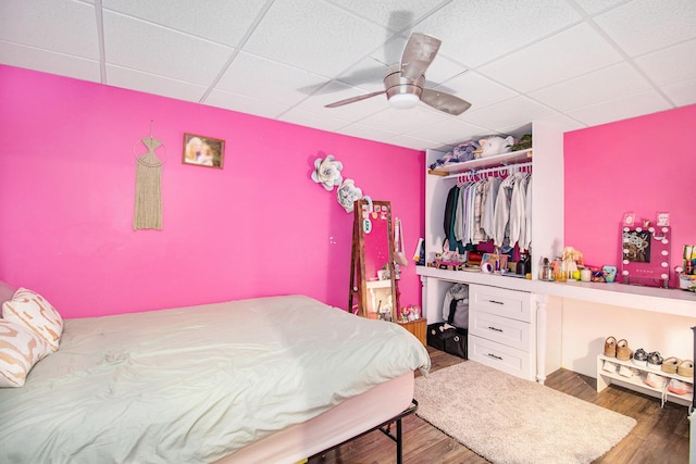 69698 Fox Xing, Edwardsburg, MI 49112 - bedroom featuring a paneled ceiling, wood finished floors, ceiling fan, and a closet