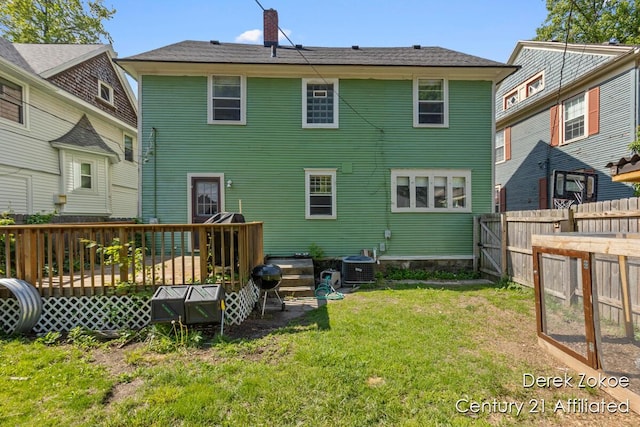 1237 Wealthy St SE, Grand Rapids, MI 49506 - back of house featuring a deck, a chimney, and central AC unit