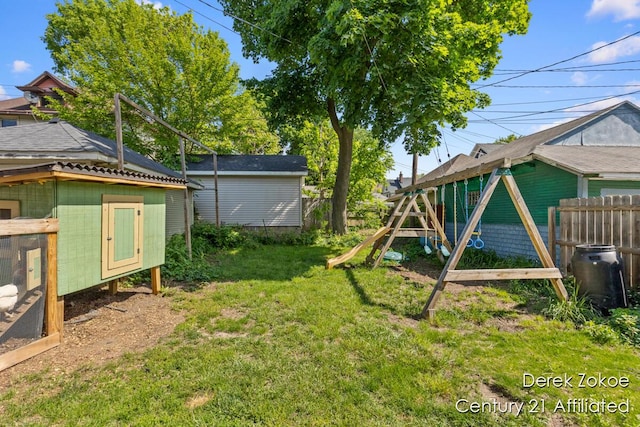1237 Wealthy St SE, Grand Rapids, MI 49506 - view of yard featuring exterior structure, an outdoor structure, and a playground