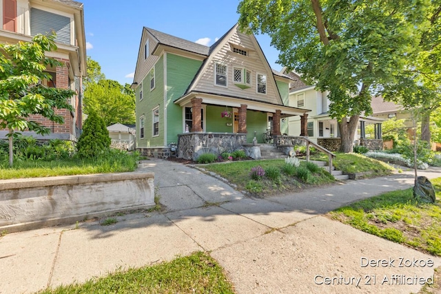 1237 Wealthy St SE, Grand Rapids, MI 49506 - view of front facade featuring a porch