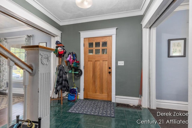 1237 Wealthy St SE, Grand Rapids, MI 49506 - entryway with tile patterned floors, ornamental molding, baseboards, and a textured ceiling