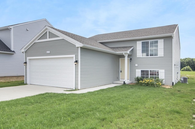 6274 Pollys Path, Berrien Springs, MI 49103 - tri-level home with a garage, concrete driveway, a front yard, and central AC unit