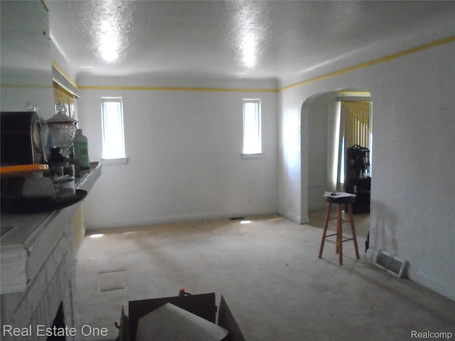 17127 Griggs St, Detroit, MI 48221 - living area featuring arched walkways and light colored carpet