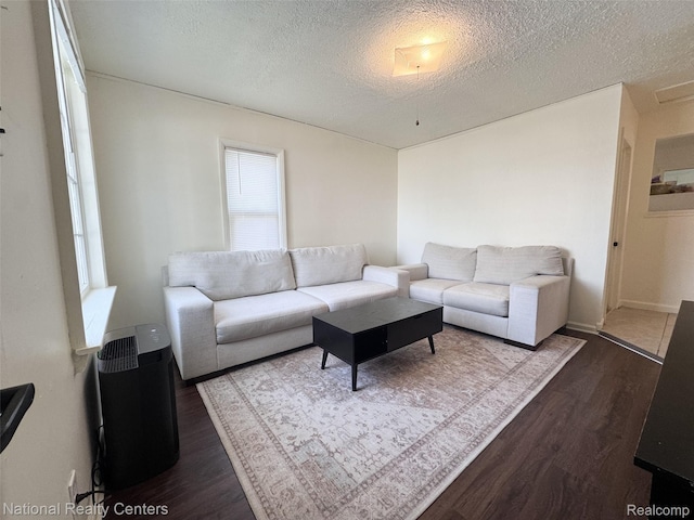 5689 Cornell St, Dearborn Heights, MI 48125 - living room with dark wood-style flooring and a textured ceiling