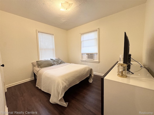 5689 Cornell St, Dearborn Heights, MI 48125 - bedroom featuring dark wood finished floors, a textured ceiling, and baseboards