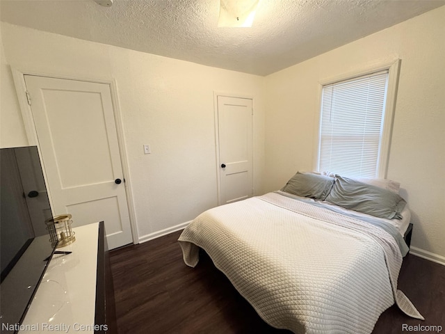 5689 Cornell St, Dearborn Heights, MI 48125 - bedroom with dark wood-type flooring, baseboards, and a textured ceiling