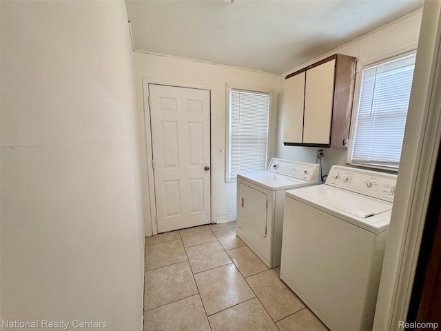 5689 Cornell St, Dearborn Heights, MI 48125 - laundry room featuring cabinet space, separate washer and dryer, and light tile patterned floors