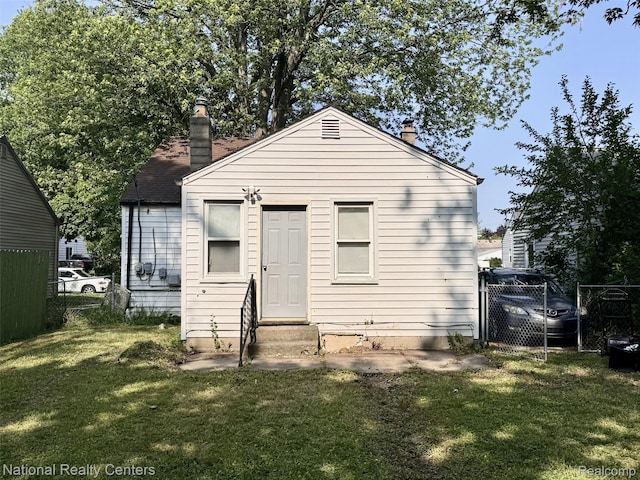 5689 Cornell St, Dearborn Heights, MI 48125 - back of house featuring entry steps and a chimney